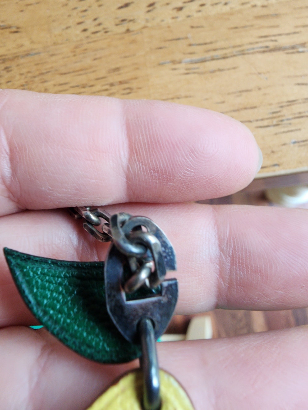 Hermès leather lemon bag charm featuring a green leaf. - Picture 6 of 10